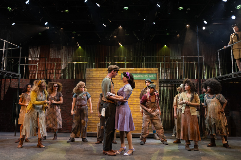 AMDA student cast of musical Urinetown performs on an elaborate stage set